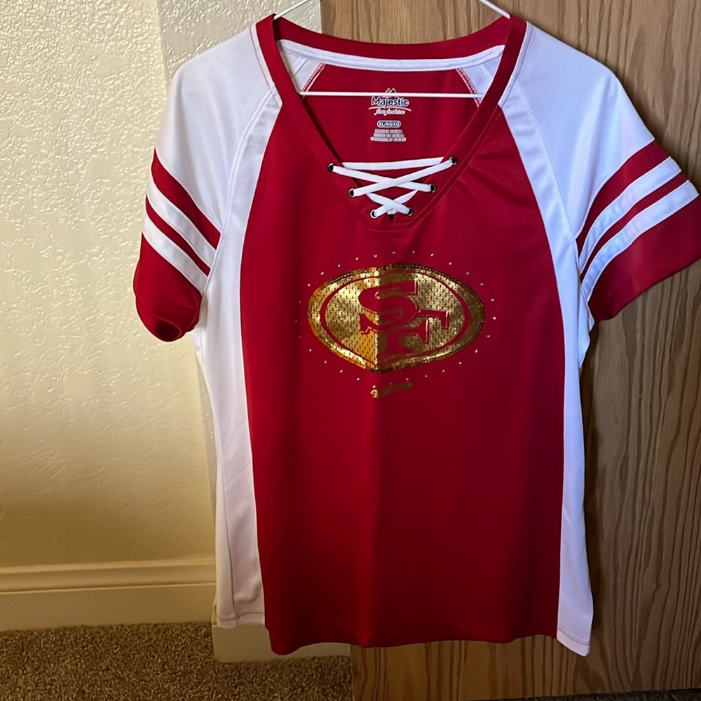 San Francisco 49ers women’s top,100% polyester,27” in length,19” in width,used